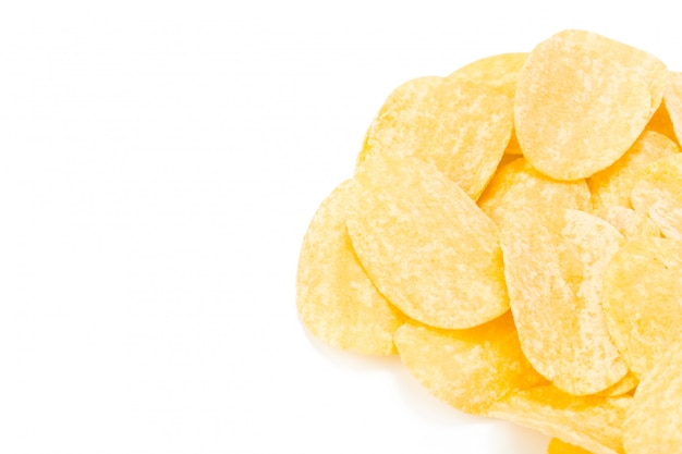 Yellow potato chips isolated on white