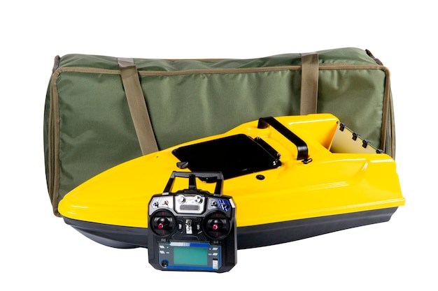 Yellow radiocontrolled vessel for delivering bait to a fish remote control and transport bag