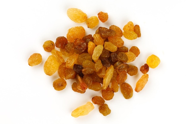 Yellow raisins on a white background