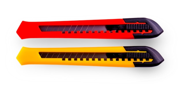 Yellow and red paper cutters with closed blade, isolated