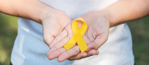 yellow ribbon for suicide prevention, sarcoma and childhood cancer awareness 