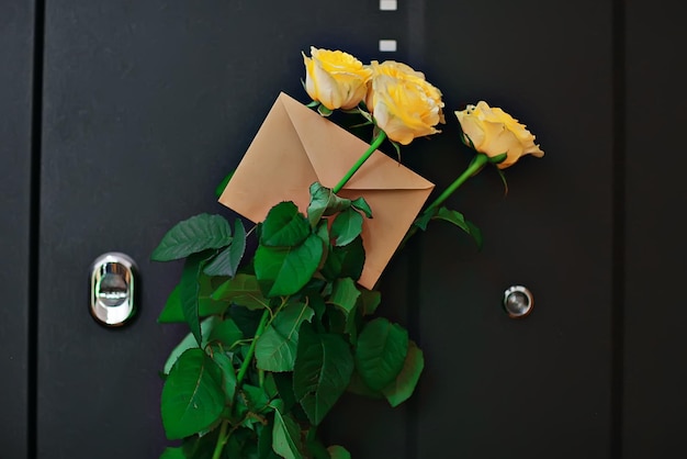 yellow roses, bouquet of flowers on the door, gift surprise spring flowers, female happiness concept