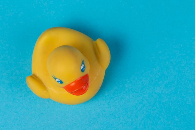 Photo yellow rubber duck for swimming on a blue background