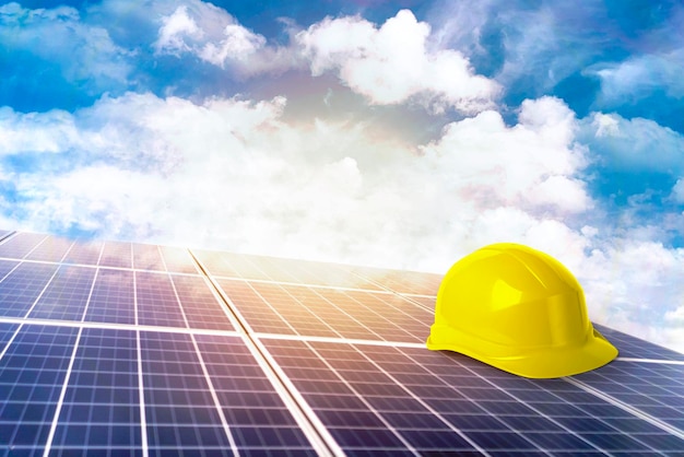 Yellow safety helmet on solar cell panel