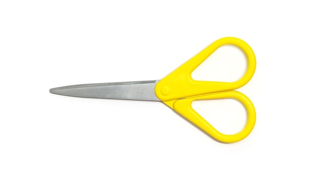 Yellow scissors isolated on white background