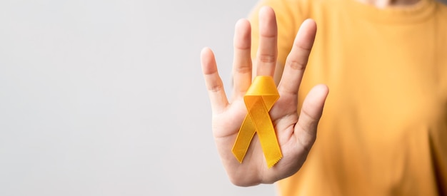 Yellow September Suicide prevention day Childhood Sarcoma bone and bladder cancer Awareness month Yellow Ribbon for supporting people life and illness Healthcare and World cancer day concept