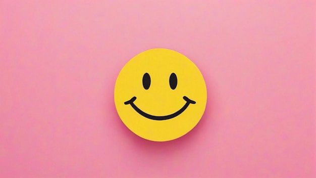 Photo a yellow smiley face on a pink background