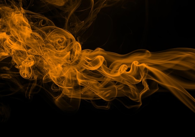 Yellow smoke abstract on black background, dense smoke, fire design