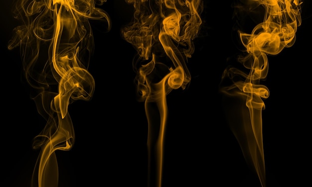 Yellow smoke abstract on black background for design