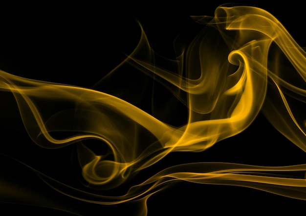 Yellow smoke abstract on black background