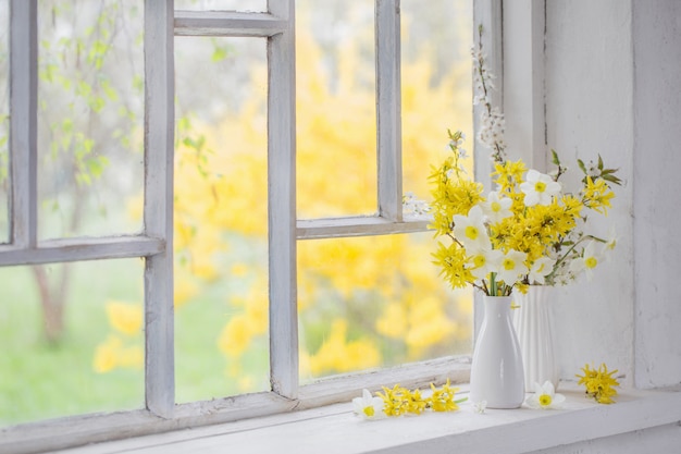 Yellow spring flowers on windowsill