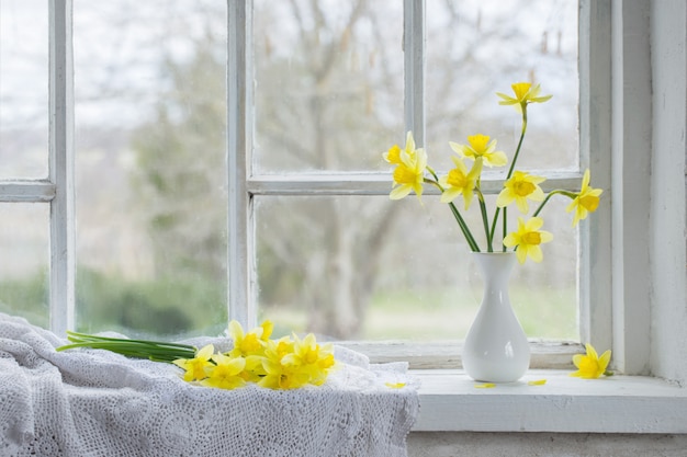 Yellow spring flowers on windowsill