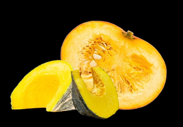 Yellow squash and pumpkin slices artistically arranged showcasing their fresh juicy textures against a deep black background