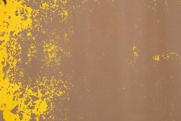 Yellow steel plate rough surface peeling paint showing rusty steel texture abstract background