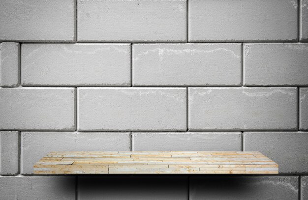 Yellow stone rock shelf counter on gray brick for product display