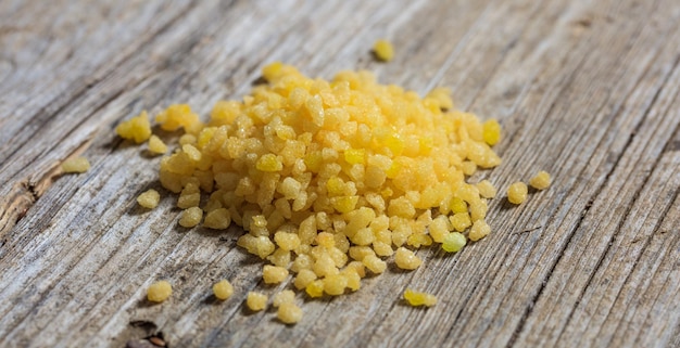 Yellow sugar on a wooden surface