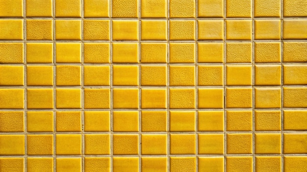 a yellow tile with a pattern of squares of yellow