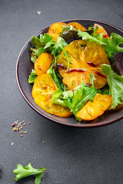 yellow tomato salad green leaf lettuce healthy meal food snack on the table copy space food