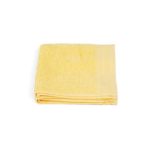 A yellow towel that is folded into a triangle