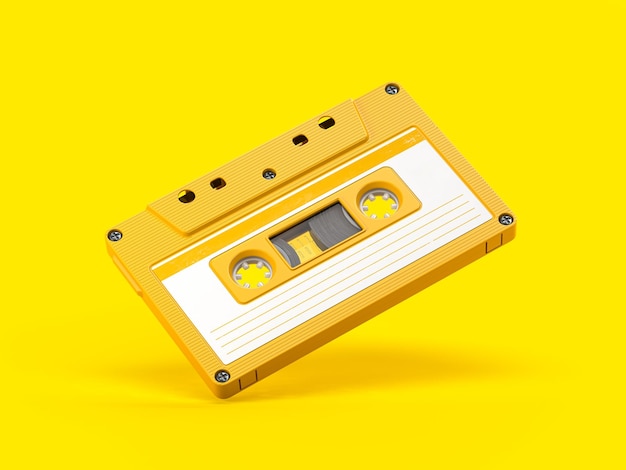 Yellow vintage audio cassette on yellow background