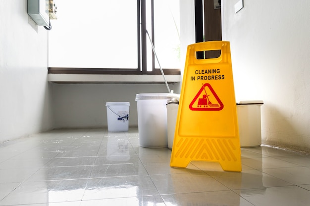 Yellow warning sign with message Cleaning in progress