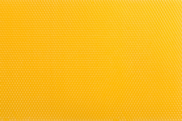 Yellow wax, natural texture of honeycombs.