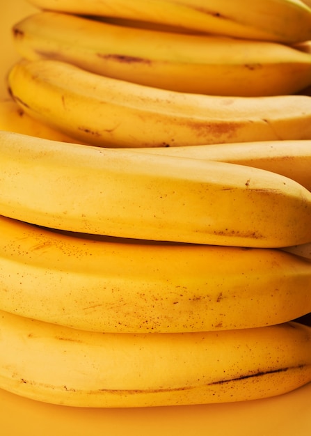 Yellow whole bananas close up background