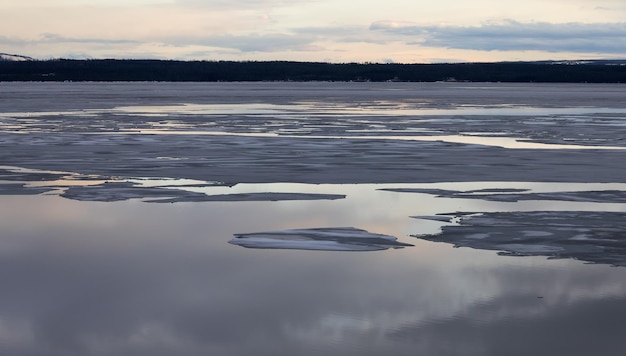 Yellowstone lake with snow covered mountains in american landscape