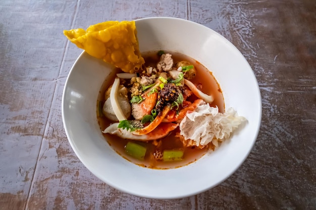 Yen Ta Fo Noodle Pink Noodle Soup with seafood soup and pink red sauce Yen Ta Fo is one of popular street food in Thailand