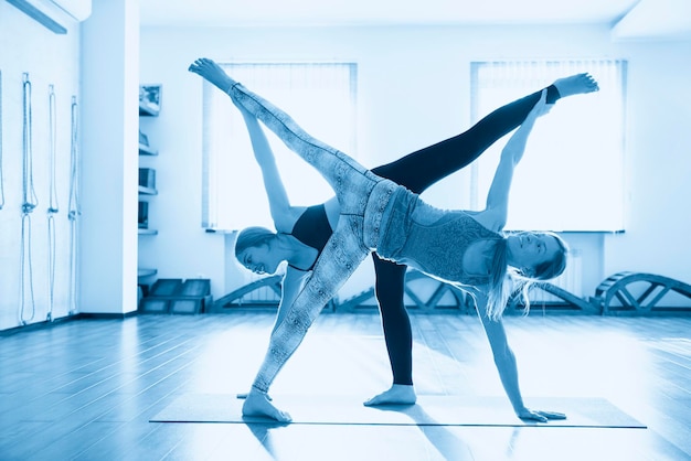 Yoga Class women Doing standing Yoga pose Wellness and Healthy Lifestyle