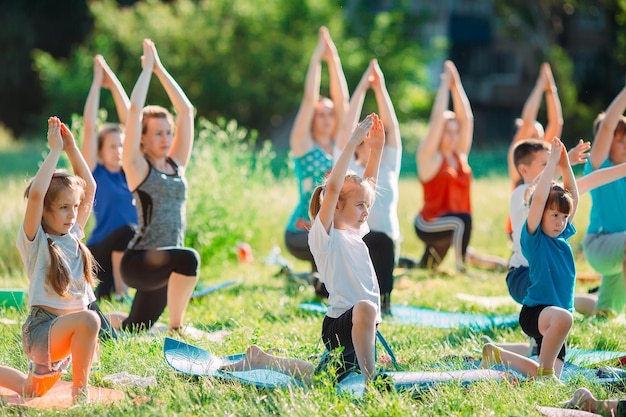 Yoga classes outside on the open air. Kids Yoga,