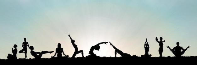 yoga group silhouette at sunset