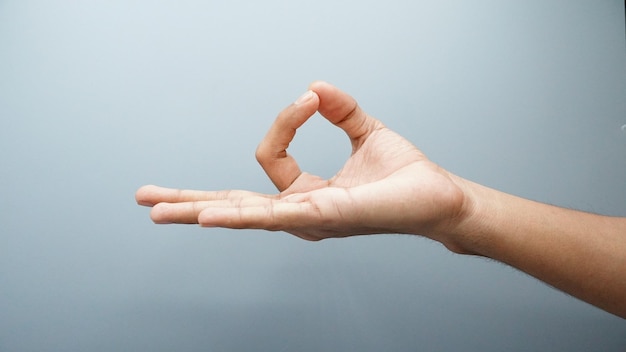 Yoga hand sign isolated on white background