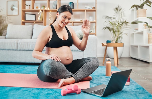 Yoga pregnant woman and meditation with laptop online class and video call for wellness and health Pregnancy pc and calm lady with zen exercise and tutorial to relax workout and peace in lounge