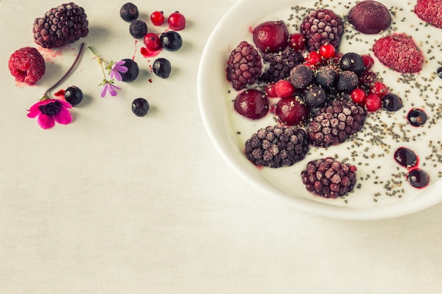 Yogurt with chia seeds and frozen berries. 