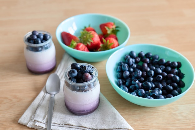 Yogurt with cranberries and strawberries healthy food concept