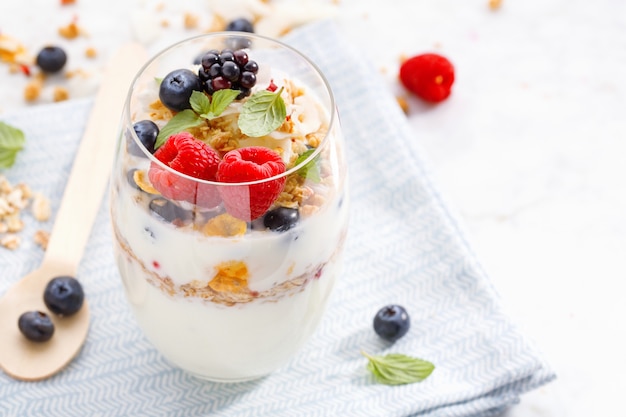 Yogurt with fresh berries served in glass