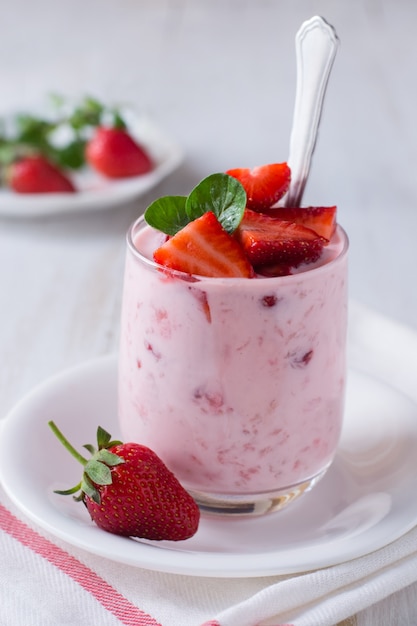 Yogurt with fresh strawberry in glass