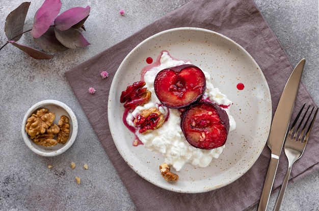 yogurt with fruits and walnuts in a plate