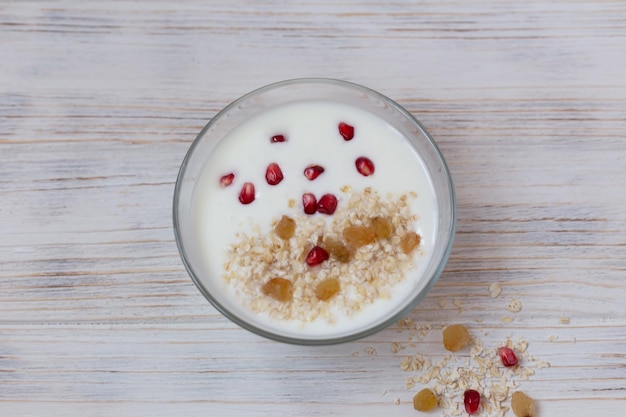 Yogurt with muesli and fruit for breakfast