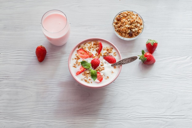 Yogurt with strawberries and granola breakfast