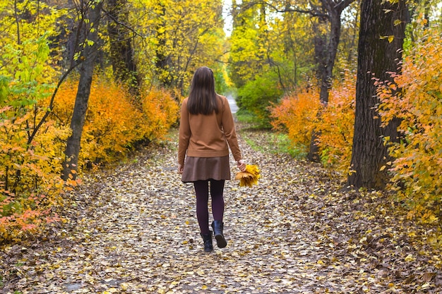 Yong woman walking in park