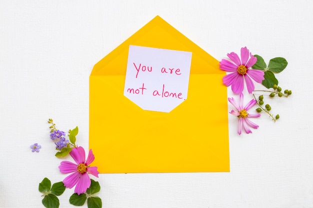 you are not alone message card handwriting in envelope