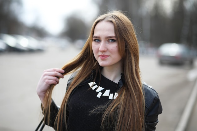 Young adult cute girl on a walk in the city