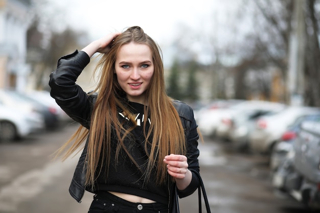 Young adult cute girl on a walk in the city