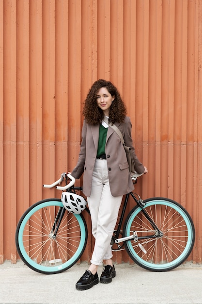 Young adult cycling to work in the city