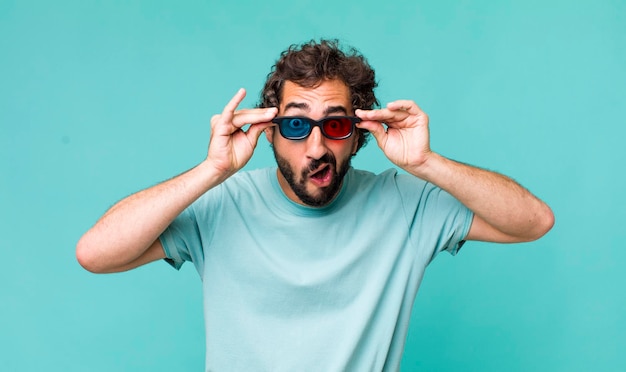 Young adult hispanic crazy man with 3d cinema glasses