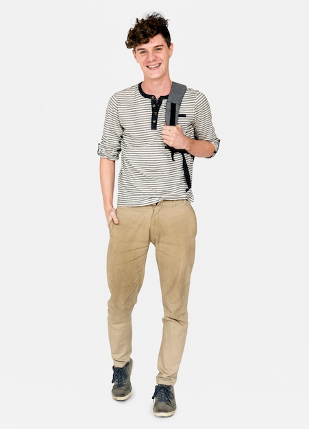 Young adult man smiling and carrying bag