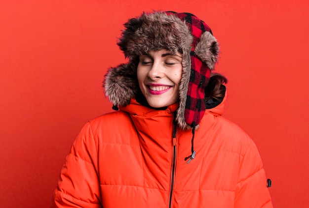 Photo young adult pretty woman wearing anorak and winter hat