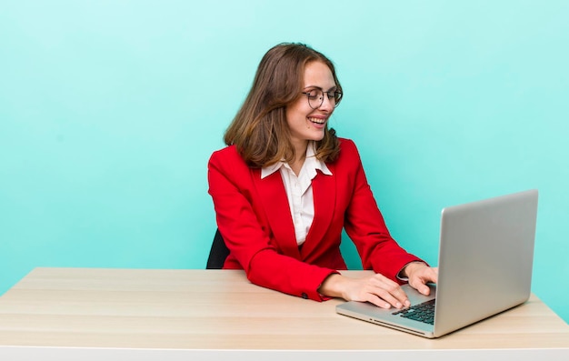 Young adult pretty woman with a laptop business concept